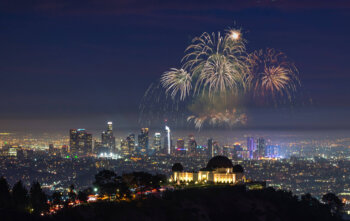 Downtown Los angeles cityscape with fireworks celebrating New Year's Eve.