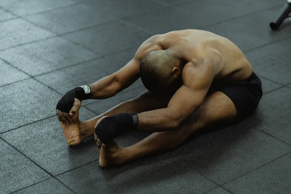 Person working out at gym fitness equipment - gym injury liability