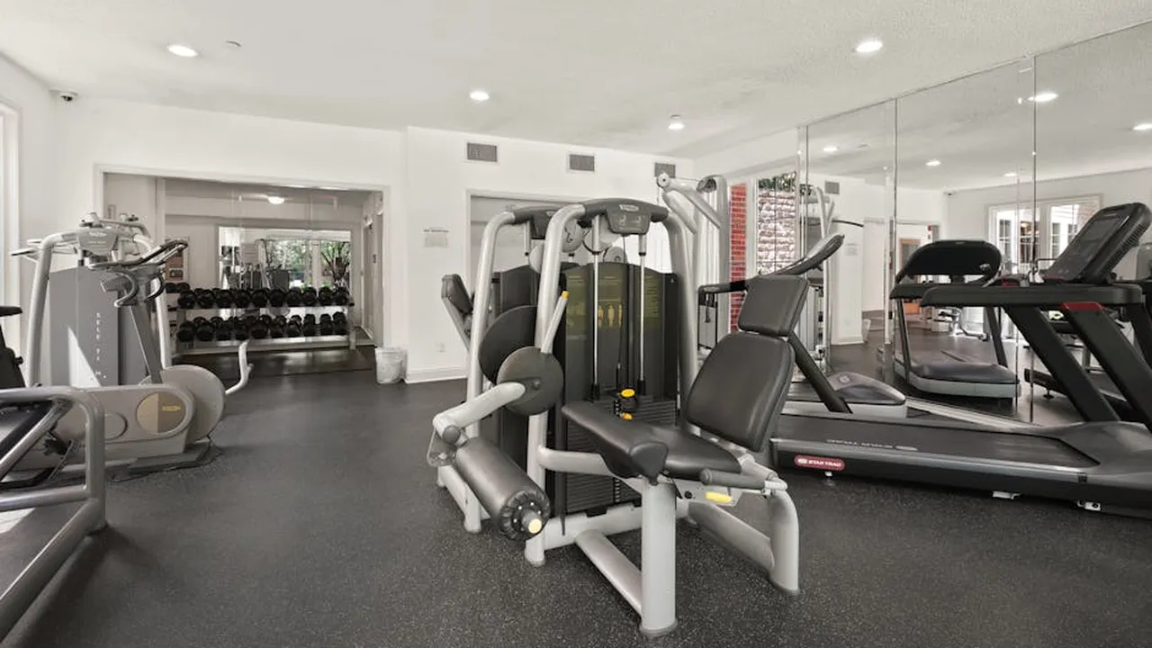 Modern corporate gym facility with exercise equipment