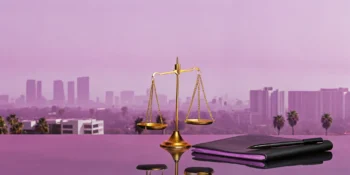 Best car accident lawyer in Los Angeles, California, with scales of justice and the city skyline.