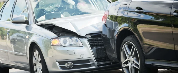 A Deldar Legal attorney speaking with a woman recovering from a rear-end collision injury in a bright California office
