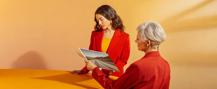 An Irvine injury attorney reviews photos from a freeway car accident case.