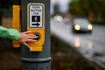 Push button to cross the intersection.