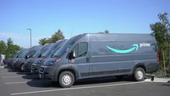 This visual connects to the topic, Amazon driver hit my car, by showing a fleet of Amazon delivery vans.