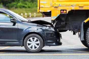 A damaged car after a rear-end collision, illustrating the need for professional help from rear-end accident lawyers.