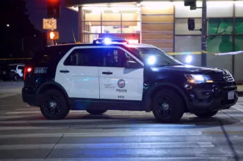 A police car blocks a California roadway during an investigation, representing enforcement of California hit-and-run laws after a crash.