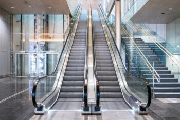 A modern building with multiple escalators represents the risks and safety concerns connected to escalator accidents in California.