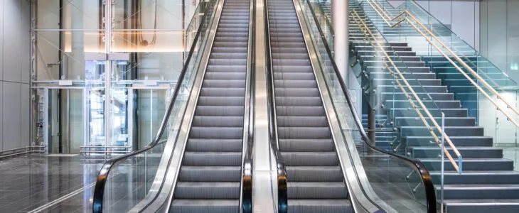 A modern building with multiple escalators represents the risks and safety concerns connected to escalator accidents in California.